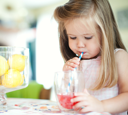 little girl drinking juice