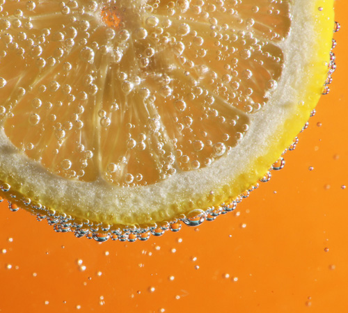 close up of lemon floating in hard seltzer drink