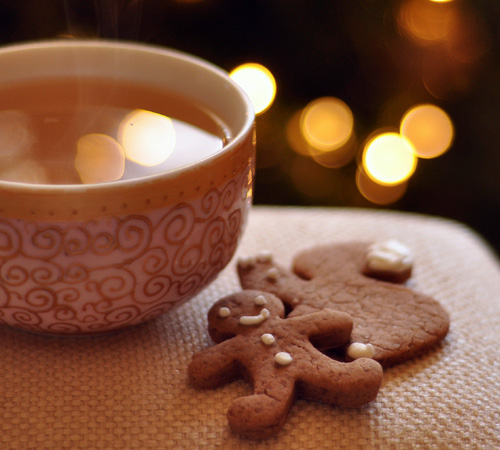 gingerbread cookie next to hot beverage